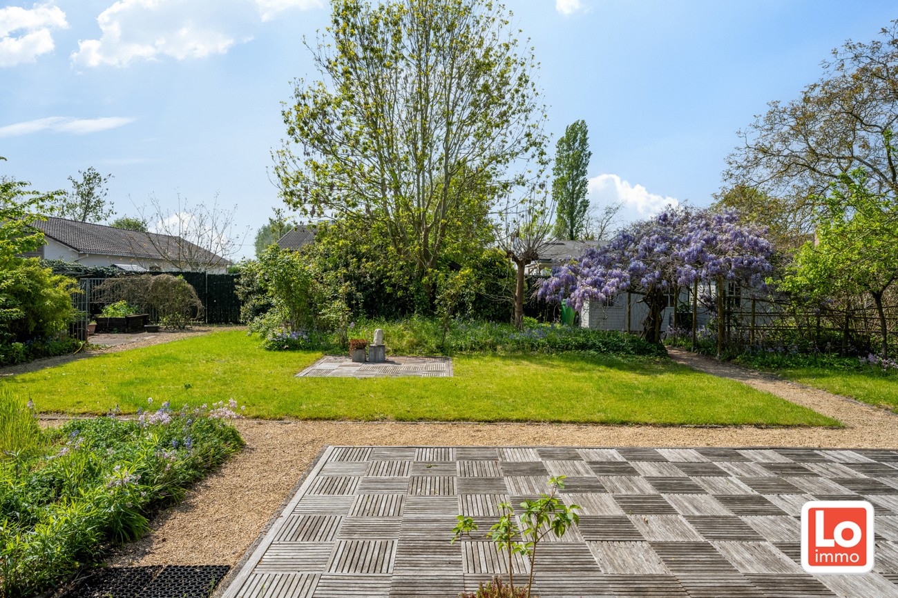 Ruime en degelijke open woning met inpandige garage en gezellige zuidwest georiënteerde tuin op een rustige locatie nabij het centrum van Lochristi! - foto 4