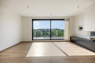 This exclusive building is a true haven of peace, strategically located near the vibrant heart of Aalter. You will be welcomed into an elegant entrance hall with a seamlessly integrated cloakroom. From here, you enter the lush, open living space. This room exudes pure class thanks to the atmospheric gas fireplace and floor-to-ceiling windows that open the space beautifully to the spacious terrace. The hyper-installed custom kitchen is a masterpiece in itself and an absolute dream for every culinary gourmet.The sophisticated night hall leads to a stylish guest toilet and two majestic bedrooms, one of which is fully equipped with floor-to-ceiling wardrobes. Both luxurious bedrooms have their own en-suite bathroom with a spacious walk-in shower. A laundry room and an extremely practical storage room complete the well thought-out layout.This home gem is 100% ready to move in: the interior is fully painted and meticulously provided with mood lighting. You can enjoy a flawless living environment all year round thanks to integrated air conditioning, automatic sunscreens, a ventilation system and private solar panels. An underground cellar and a secure, closed garage box are included as standard and maximize your daily comfort.Trade union information on request.Register of measures: no