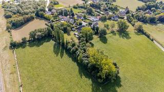 <p><strong>Looking for space, tranquility, and character in a prime location?</strong><br />This unique property, set on a generous <strong>53 ares</strong> of land in the charming village of <strong>Hoegaarden</strong>, combines an idyllic green setting with excellent access to the city and major roads.</p>
<p>With a <strong>living area of 252 m²</strong>, the home offers plenty of potential for families, animal lovers, or self-employed professionals. It features <strong>6 full-sized bedrooms</strong>, a <strong>spacious attic</strong>, and a <strong>basement with extra storage space</strong> – ideal for those who need room or are looking for a property with potential.</p>
<p>While <strong>partially in need of renovation</strong>, <strong>there is no immediate obligation</strong> thanks to the favorable <strong>EPC label D</strong>. The house is already equipped with <strong>solar panels</strong>, contributing to more energy-efficient living. Outside, you’ll enjoy a <strong>green and spacious setting</strong>, with <strong>ample on-site parking</strong>.<br /><br /><br /></p>
<p><br /><br /></p>
<p><br /><br /></p>