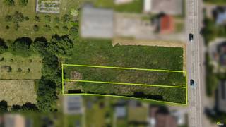 Grande parcelle (1515 m² utiles) de terrain à bâtir avec bâtiment démoli, située au calme avec vue sur les terres agricoles et pourtant proche...