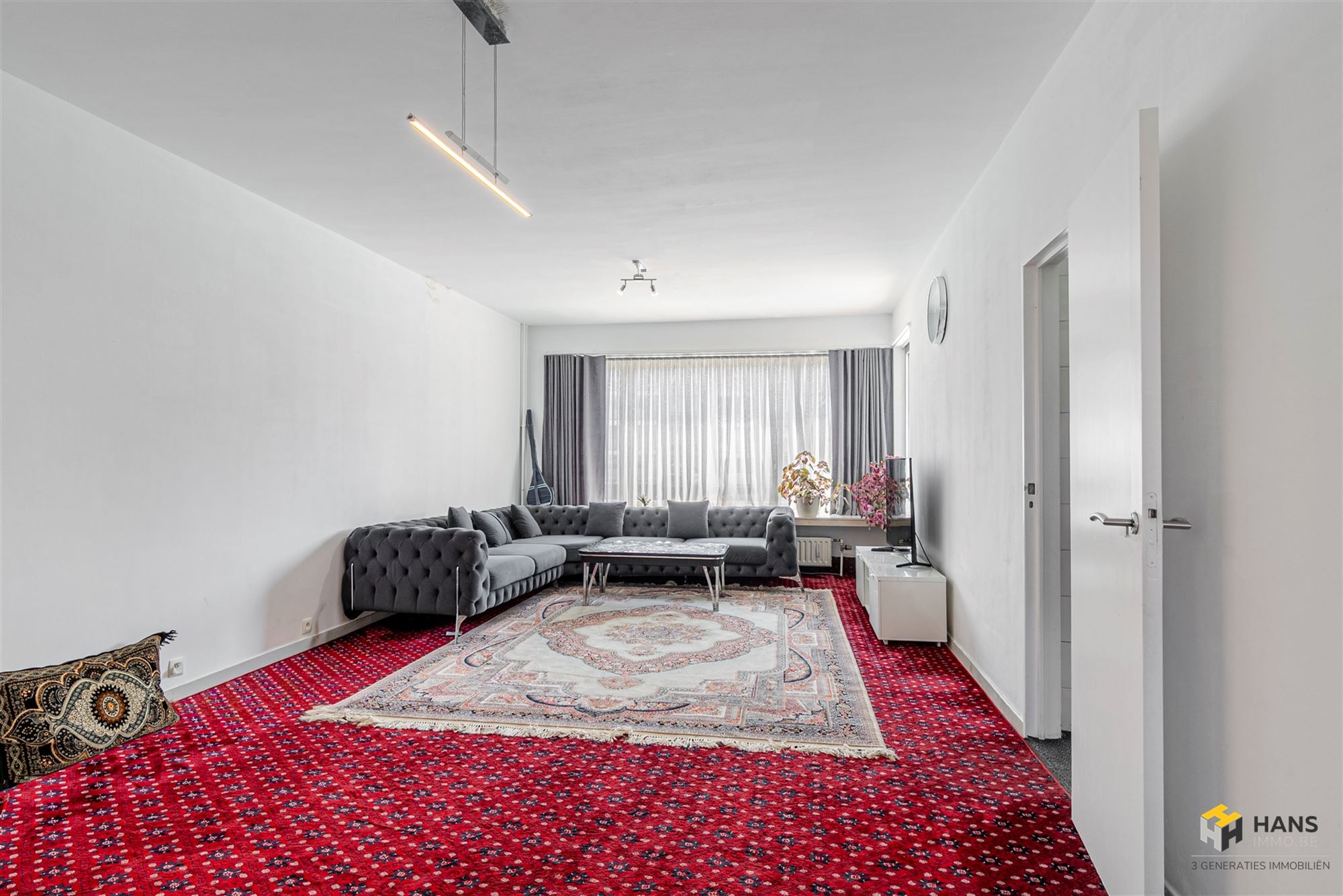 Ruim appartement (110 m²) met 3 slaapkamers, garagebox  en zuid-georiënteerd balkon (3 m²) in Deurne. - foto 4