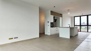 <p>Ontdek dit moderne appartement, gelegen op de eerste verdieping van een nieuwbouwproject aan de Rommelsweg in Sint-Laureins.<br /><br />Met een bewoonbare oppervlakte van 116 vierkante meter en een ruim zonnig terras, biedt dit appartement een genotvolle en comfortabele woonruimte die perfect aansluit bij de hedendaagse levensstijl.<br /><br />De slimme indeling zorgt voor een harmonieuze flow tussen de verschillende ruimtes, waardoor u zich hier snel thuis zult voelen.<br /> </p>
<p>Het appartement beschikt over een ruime woonkamer met eetplaats en zithoek. In de leefruimte is er ook nog een ruime keuken met kookeiland.<br /><br />Er zijn twee comfortabele slaapkamers met hoge raampartijen en een eigentijdse badkamer met ruime inloopdouche. Er is ook nog een gastentoilet en bergplaats voor wasmachine en droogkast.<br /><br />Op het gelijkvloers is er een eigen parkeerplaats met laadpaal en een private berging voor fietsen en maken het geheel compleet en zorgen voor extra gemak in uw dagelijks leven.<br /><br />Dit alles bevindt zich in een rustige omgeving, met goede toegang tot de lokale voorzieningen en een vriendelijk buurtgevoel.<br /><br /> </p>
<p>Mis deze kans niet om dit instapklare appartement zelf te ervaren. Neem vandaag nog contact met ons op via onze website voor een bezichtiging en laat u verrassen door alles wat dit mooie appartement te bieden heeft.</p>