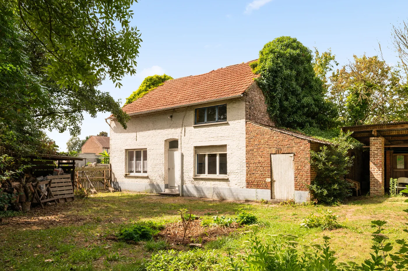 Open bebouwing in Linter met groot perceel en tuin - foto 1
