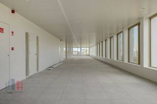 This 675 sqm office space is located on the ground floor and forms part of the high-quality ‘Atmos’ office complex, consisting of five BREEAM OUTSTANDING-certified buildings. These offices are ready to move in and are located in green surroundings with a car-free courtyard. Thanks to the attention to architecture and functionality, these sustainable offices are the ideal environment for innovation and collaboration in Ghent. The offices are future-oriented and comply with upcoming strict European regulations, such as the EU taxonomy. The complex offers ample underground parking facilities, including charging stations, and a public car park under construction, with completion scheduled for January 2025.<br /><br />The building is strategically located on the R4 ring road around Ghent, just 4 minutes' drive from the E40 on-ramp and exit Sint-Denijs-Westrem and 7 minutes from the E17. Sint-Pieters station is 1.6 km away, which is an 8-minute bike ride or a 22-minute walk. In addition, a tram stop is just 900 metres away. The office building also offers excellent visibility from the R4, contributing to its prominent location.<br />Purchase of the offices is also possible.<br /><br /><br />For more information, the specifications or a no-obligation site visit, please contact PANORAMA B2B GENT KANTOREN on 09 225 09 02.