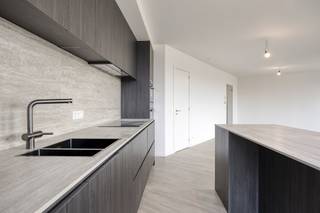 V1L Rivert new build apartment approx 110 m²General Features:- new build project in top location in Antwerp- terrace with unique views of the Scheldt and the Linkeroever marina - underfloor heating- microtopping and customization option- partly sales under registration, partly under VATLayout - entrance hall with separate toilet- living space with beautiful view of the Scheldt- open kitchen with island- storeroom- terrace with sliding windows- 2 bedrooms in the back- bathroom with bathtub and shower- accessible green roof Microtopping “Less is More”This new build project in Antwerp offers several additional options for finishing such as microtopping. Microtopping is a perfect choice for those who love a seamless surface, vertically or horizontally for a unique, elegant and modern look. An endless choice of colours, effects and finishes. Even MoreGoplus gives you even more options in Rivert, which is to fully customize the overall interior. This ranges from an integrated wood veneer wall to partitions, dressing and doors. The sky's the limit! Sales under VAT system.Are you interested in new construction, apartment or property for sale in Antwerp? Please don't hesitate to contact us.If you would like to offer your own property for sale please contact us for a non-binding estimate, by phone at 03/206.76.76 or by email to antwerpen@dewaele.com. You can also contact us for all other questions about real estate, buying or selling in Antwerp!