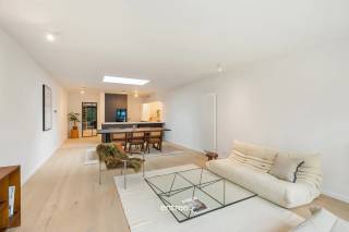 Located on a quiet street at the border of Merelbeke-Flora, Gentbrugge, and Ghent, this fully renovated townhouse (with building permit) features 4 bedrooms and 2 bathrooms.<br /><br />Everything you need for daily life is within easy reach.<br /><br />Layout:<br /><br />* Ground floor: entrance hall, bike/multipurpose storage, technical/laundry room, guest toilet, and a spacious living area with an open kitchen. From the living room, you can access the perfectly south-facing terrace leading to the garden. <br />* First floor: landing, toilet, beautiful bathroom with double sinks and a large walk-in shower, and 2 large, bright bedrooms. <br />* Second floor: landing, 1 large bedroom, 1 children's bedroom, and a second bathroom with a bathtub and sink.<br /><br />Some highlights include the smart home system, solar panels, Duco system D ventilation, the wrought iron door between the entrance and living area, oak parquet flooring throughout the house (except wet zones), fully painted walls, and LED lighting... in short, this is a gem worth visiting!<br /><br />This property can be purchased with a reduced registration fee of 2% (on the total price).<br /><br />Accessibility is excellent: just 10 minutes by bike from Ghent city center, 1 minute cycling to Merelbeke train station, walking distance to public transport, and 4 minutes by car to the E17/E40 highway entrance.<br /><br />Mobiscore: 8.6/10<br /><br />For more information, contact Pieterjan at pw@entree.be or call 0472 80 20 65.