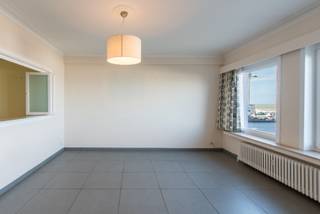 Bright and spacious living area with beautiful sea view.<br />Spacious entrance hall with a tidy bathroom.<br />Fully equipped kitchen.<br />2 spacious bedrooms with terrace.<br />Separate storage room with washing machine and sink.<br />Cost-effective central heating.<br />Private cellar.<br />Possibility to purchase a garage in the building.