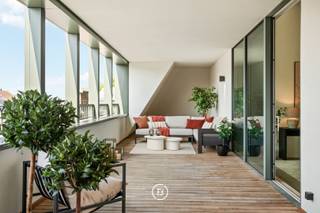 Exceptional new build penthouse in the prestigious former Leopoldskazerne, where characterful architecture and contemporary living comfort come together.<br /><br />With 217 m² of living space and a sunny terrace of 50 m², this apartment offers a unique living experience in a prime location.<br /><br />Upon entering, the spacious entrance hall with guest toilet leads to the open plan kitchen. The impressive ceiling height and authentic vaults give this space a special character. The kitchen is finished to a high standard with custom-made and Miele appliances and has a spacious pantry.<br /><br />The dining area directly connects to the sunny terrace and benefits from abundant natural light thanks to the large windows.<br /><br />On the mezzanine level, there is a versatile living space, ideal as a study, hobby room, or additional seating area. On the upper level, there is a second spacious living area, bathed in light thanks to the various skylights and the unique open structure.<br /><br />The apartment has 3 full bedrooms and 2 bathrooms. The master bedroom has an ensuite bathroom with double sink, bathtub, walk-in shower, and separate toilet. There is also space for a dressing room according to personal preference. Additionally, there is a separate laundry room and 2 cellar storage spaces included.<br /><br />Technically, the apartment is equipped with underfloor heating and ventilation type D.<br /><br />Optionally, 2 underground parking spaces can be purchased at €55,000 per space.<br /><br />An exceptional penthouse for those who want to combine space, light, luxury, and character in a unique location.