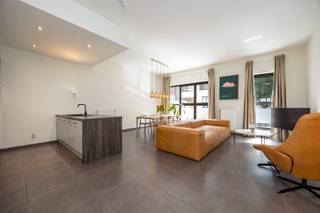 <p><span>Living in the Eilandje neighborhood, with a terrace or garden for your BBQ enjoyment? Say no more.</span></p><p><span>Let yourself be tempted by this move-in-ready ground-floor apartment in the Cadix neighborhood, one of Antwerp’s most revitalized residential areas. Peace and quiet combined with urban vibrancy, within walking distance of the MAS, the marina, the Scheldt River, and the historic city center. (Yes, really—all within walking distance.)</span></p><p><span>Come home to a pleasant living space with ceiling heights of no less than 3 meters, large windows, and a terrace with a garden of over 65 m². Your own urban oasis right in the heart of 't stad. Rare? Absolutely.</span></p><p><span>Prime location in the Cadix neighborhood</span><span>, right next to the green Schengenplein, on a street with very little foot traffic. All the amenities you need are just around the corner. A supermarket, public transportation—and let’s not even get started on all the cafés's and restaurants, right? Everything is within walking distance. And if enjoying an aperitif within walking distance of the waterfront at 't Eilandje isn’t a selling point, then we don’t know what is.</span></p><p><span>Why should you plan a visit?</span></p><ul><li><span>Move-in-ready ground-floor apartment of approx. 95 m²</span></li><li><span>Terrace of approx. 65 m²—plenty of space for the BBQ, the hammock, and that hot tub you’ve been dreaming about for years</span></li><li><span>3-meter-high ceilings, an exceptional sense of space</span></li><li><span>EPC rating B—energy-efficient and future-proof</span></li><li><span>Fully equipped open kitchen</span></li><li><span>2 full-sized bedrooms, both with direct access to the terrace </span></li><li><span>Spacious storage room with connections for a washer and dryer</span></li><li><span>Additional storage space in the basement</span></li><li><span>Quiet street with very little traffic</span></li></ul><p><span>The living area is the heart of the apartment. It flows beautifully into the open kitchen and dining area. You’ll notice the 3-meter ceiling height the moment you walk in. Loft vibes, without the downsides of a loft.</span></p><p><span>Both bedrooms open directly onto the terrace. It’s a nice touch to slide open your window on summer mornings and enjoy your coffee outside. Both rooms are spacious enough and offer the flexibility you’re looking for: one master bedroom, and one for the kids, guests, or that home office you’ve been thinking about.</span></p><p><span>Are you looking for a stylish, move-in-ready home in one of Antwerp’s most attractive locations? Then this is an opportunity you won’t want to miss.<br />Schedule your visit today before it’s too late. 0472575295 or george@sinjoor.be</span></p>