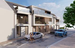 <strong>Mogelijkheid aankoop aan 6% BTW tarief!</strong><br /><br />Dit <strong>energiezuinig</strong> appartement is gelegen in de Kapellestraat op het <strong>gelijkvloers</strong> en geniet van een<strong> ruime privétuin (54,44m<sup>2</sup>)</strong> met mogelijkheid tot het aankopen van een <strong>garage aanpalend aan de tuin</strong>.<br />Daar bijkomend is er de mogelijkheid van er een <strong>extra tuinberging (4,20m<sup>2</sup>)</strong> bij te nemen.<br /><br />Indeling:<br /><strong>Inkomhal </strong>die toegang biedt naar de <strong>2 ruime slaapkamers</strong>, <strong>badkamer</strong> en <strong>gastentoilet</strong>. Verder is er de <strong>woonkamer met open leefkeuken</strong> en <strong>aparte berging</strong>.<br />Dankzij de grote raampartijen is er sprake van <strong>veel natuurlijk lichtinval</strong> en is er een <strong>mooi zicht op de zonnige tuin</strong>. Luxe en wooncomfort staan hierbij op de voorgrond.<br /><br />Het appartement wordt <strong>afgewerkt opgeleverd</strong>, waarbij u als koper de <strong>materialen nog zelf mag bepalen</strong>.<br /><br />Op alle appartementen zijn <strong>zonnepanelen</strong> aangesloten.<br /><br /><strong>Oppervlakte appartement: 94,50m<sup>2</sup></strong>.<br /><br />