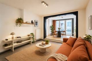 <p><b>Elegant Apartment in the Heart of Antwerp</b></p><p>Welcome to this beautiful 2-bedroom apartment located in lively Antwerp. With a living area of 73m² and a total ground area of 83m², this property offers the perfect balance of comfort and efficiency for modern residents.</p><p><b>Main features:</b></p><p>This charming apartment features two spacious bedrooms, each with natural light and wooden floors that add warmth and character. The first bedroom has access to windows with views, while the second bedroom is ideal for guest accommodation or as a work space.</p><p><b>Living space:</b></p><p>The open and spacious living room is the heart of the home, equipped with large windows that let in plenty of natural light. This airy space is perfect for both relaxing and entertaining and creates a seamless connection to other parts of the apartment.</p><p><b>Kitchen and Plumbing:</b></p><p>The modern kitchenette is practical and well laid out with all the necessary appliances. The single bathroom features a pleasant layout, including a black-tiled shower stall and a modern sink unit.</p><p><b>Additional Spaces:</b></p><p>The apartment also features a practical toilet, an entrance hall with storage space, and an excellent layout that offers maximum functionality.</p><p><b>Balcony and Outdoor Space:</b></p><p>Enjoy a private balcony or terrace with wooden decking, perfect for relaxation and as an extension of your living space.</p><p><b>Benefits of this Location:</b></p><p>This apartment is ideally located in Antwerp, close to stores, restaurants, public transportation and cultural attractions. The modern architecture and minimalist design make this a desirable place for professionals and starters.</p><p>This is a unique opportunity to own a stylish, well-maintained home in the heart of Antwerp.</p>
