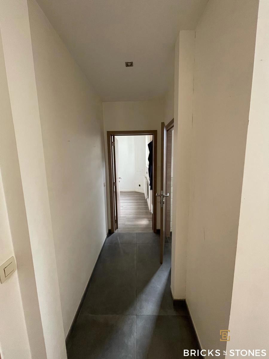 Gerenoveerd gelijkvloers appartement met riante tuin - foto 5