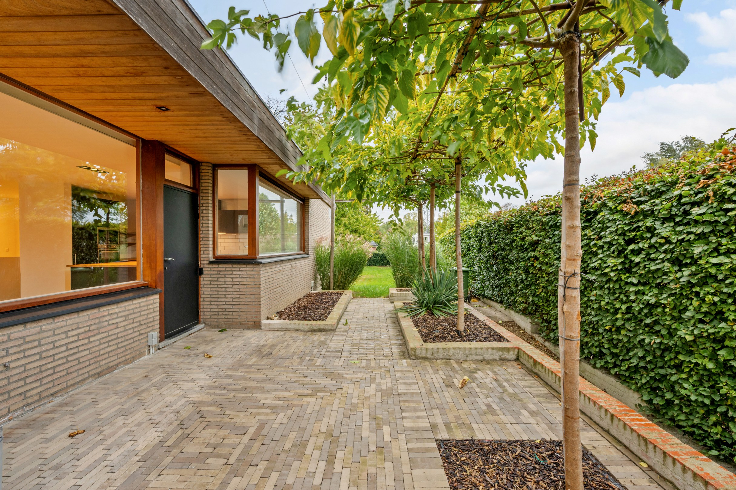 Villa avec étage de vie surélevé sur un magnifique terrain de 1 100 m² dans un quartier résidentiel à Hasselt. - photo 3