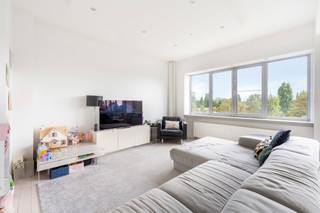 Renovated Three-Bedroom Apartment with Terrace and Panoramic Green ViewsEntrance hall with cloakroom and guest toilet with hand basin. Access to a...