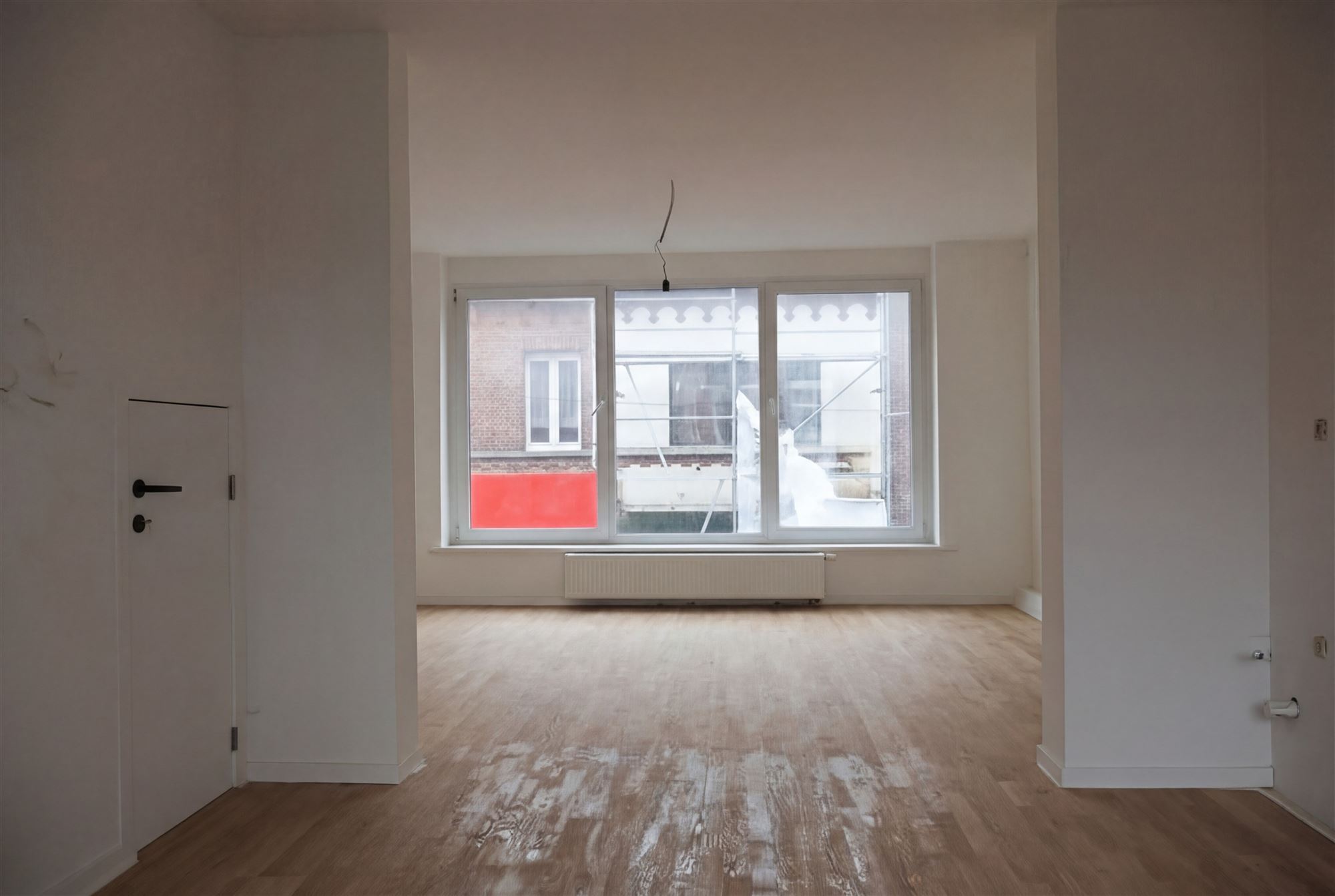 Opbrengsteigendom met handelszaak en bovengelegen triplex - foto 2