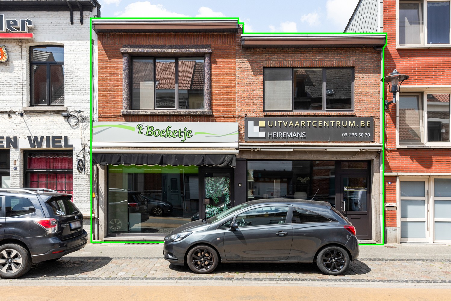 Handelshuis met 2 handelsruimtes en appartement in het hart van Wommelgem. - foto 1