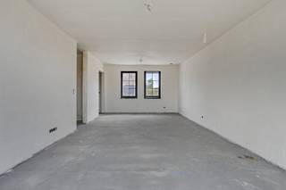 Deze ruime energiezuinige nieuwbouwwoning (bewoonbare oppervlakte +/- 197 m²) beschikt over 3 volwaardige slaapkamers en een badkamer. Er is de mogelijkheid voor een vierde, vijfde en badkamer op zolder. Buiten is er een carport voorzien en zuidwest gerichte tuin.Deze woning wordt volledig afgewerkt. INDELINGGelijkvloers:Inkomhal - apart toilet - leefruimte - open keuken - wasplaats/berging- tuin - carport Eerste verdiep:Nachthal - apart toilet - slaapkamer 1 - slaapkamer 2 - slaapkamer 3 - badkamer met bad en doucheTweede verdiep:Zolder met vaste trap met mogelijkheid om een 4de slaapkamer + 5de slaapkamer + badkamer + bergruimte te creërenDerde verdiep:Extra zolder met valtrapTROEVEN+ BEN-woning - 10 zonnepanelen+ Regenwaterput 10.000l+ Ventilatiesysteem D+ 4 verdiepingen+ Mogelijkheid voor 4de & 5de kamer & badkamer in zolder+ Woning wordt nog volledig afgewerkt+ Volledige vrijstelling onroerende voorheffing eerste 5 jaarVerkoop onder 21% BTW! Contacteer ons voor een afspraak 065 605 605 of via rob.vandaele@dewaele.comDisclaimer: De AI-visualisaties zijn bedoeld als inspiratie. Er werd geen rekening gehouden met technische specificaties, stedenbouwkundige voorschriften of de concrete mogelijkheden tot realisatie.