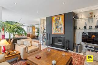 <p><span>SALE &amp; LEASE BACK - Beautiful 2 bedroom apartment with front and rear terraces!</span></p><p><span>Do not miss this investment opportunity. This apartment has an excellent location in the residential area of Fruithof. With several stores, schools public transportation, this quiet but central location has numerous assets! This apartment located on the 10th floor of excellently maintained building with elevator awaits its next owner.</span></p><p><span> </span></p><p><span>What does the Sale &amp; Lease Back formula entail?</span></p><p><span>With this formula you buy the property and immediately rent it back to the current owner. For you as an investor, this means an immediate return from the deed, without the risk of vacancy. You benefit from the security of a motivated tenant who knows the property inside out and will continue to occupy it with the utmost care.</span></p><p><span> </span></p><p><span>Entrance, living space &amp; kitchen:</span></p><p><span>You enter the apartment through the entrance hall equipped with a security door and videophone. In the hall we find a separate toilet as well as a convenient storage room with connection for a washing machine and dryer. From the entrance hall you walk into the spacious living room (approx. 50 m²) which has a nice layout giving you a separate lounge and separate dining room. Moreover, you will enjoy beautiful natural light and a breathtaking view of the Antwerp skyline. For some extra atmosphere and cosiness you can use the bio-ethanol fireplace. There is also air conditioning. The kitchen was equipped with all modern appliances.</span></p><p><span> </span></p><p><span>Bedrooms &amp; bathrooms:</span></p><p><span>At the back of the apartment there are 2 spacious bedrooms (approx. 26 and 15 m²). The master bedroom is an amalgamation of originally 2 bedrooms. This bedroom is also equipped with air conditioning and electric blinds. Both bedrooms have the same beautiful parquet floor as well as convenient built-in closets. The first bathroom has a modern sink cabinet with mirrored cabinet, bathtub, walk-in shower and hanging toilet. The shower room has a sink cabinet in addition to a shower. </span></p><p><span>  </span></p><p><span>Terraces: </span></p><p><span>The apartment has 2 terraces allowing you to enjoy the sun throughout the day. The southeast facing terrace at the back can be reached through the bedrooms. The front terrace is accessible through the living room and kitchen. Here you can enjoy the afternoon/evening sun with views of Antwerp! </span></p><p><span> </span></p><p><span>Basement &amp; pitch:</span></p><p><span>A spacious basement is located underground. Behind the building is an above-ground pitch included in the price.</span></p><p><span> </span></p><p><span>Conditions:</span></p><p><span>- Lifetime lease (notarized).</span></p><p><span>- Guaranteed monthly rental income of € 1,500, excluding fees.</span></p><p><span>- Certainty of good tenants and good maintenance.</span></p><p><span> </span></p><p><span>Details:</span></p><p><span>- Very well maintained building</span></p><p><span>- Excellent inspection certificates: Asbestos free apartment - completely renewed electricity with compliant inspection - EPC B label</span></p><p><span>- Renewed windows with high efficiency glazing</span></p><p><span>- Surface area is 145 m² (cfr. EPC)</span></p><p><span> </span></p><p><span>Do not miss this unique investment opportunity! </span></p><p><span> </span></p>