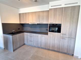 <p><span>Centrally located in Heist-Goor, we are pleased to present a newly built 2-bedroom apartment on the second floor. The apartment is located in a building with only 5 units.<br /><br /></span></p><p><span>This 85m² apartment features a spacious living area with an open kitchen (fully equipped), two bedrooms measuring 14m² and 8m², and a bathroom with a walk-in shower. There is also a spacious utility room and a separate toilet.<br /><br />There is a private covered terrace of 10m² adjoining the living area and kitchen, located at the rear of the building, offering a beautiful view of the 2,000m² green space behind the building, as well as the woods beyond. Access to a private garage, a communal bicycle storage area, and a separate storage room is included in the rent.<br /><br />This energy-efficient BEN apartment comes with an EPC rating of 9 kWh/(m²·year) and is also equipped with solar panels. The building is further equipped with an elevator. Available starting August 1, 2026.<br /><br />The common area fees are only 50 euros per month.</span><span><br /><br />Schedule your appointment online using the button on our website.</span><span> For any other questions, please contact us at 015/15 15 15 or info@dupont-vastgoed.be. <br /><br /></span></p>