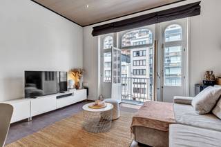 <p>Looking for a spacious apartment by the sea with just that extra touch of character? This move-in ready duplex of 95 m² is centrally located in Blankenberge and combines the charm of a characterful building with the comfort of a contemporary apartment.</p><p></p><p>Thanks to its location, you'll live within walking distance of the seafront promenade and the beach, while shops, restaurants, public transport and the train station are also nearby. This makes the apartment appealing not only as a permanent residence, but also as a comfortable second home or as a property investment on the Belgian coast.</p><p></p><p><strong>Spacious living spread over two floors</strong></p><p>The apartment is located on the third and fourth floors and features a pleasant duplex layout. With a livable surface area of 95 m², there's remarkably plenty of space for a coastal apartment.</p><p></p><p>Inside you'll find a cosy living area and a fitted kitchen. The two full-size bedrooms offer ample space for a couple, family or guests, making this apartment particularly appealing for those who like to regularly welcome family or friends to the coast.</p><p></p><p>The bathroom was completely renovated in 2025, giving the apartment a fresh, contemporary feel. A small terrace at the front provides additional outdoor space.</p><p></p><p>You also have a private cellar and a small bicycle storage area: practical extras that certainly come in handy at the coast.</p><p></p><p><strong>Move-in ready with character</strong></p><p>Over the years, the apartment has been well maintained and renovated, and is now move-in ready. The electrical installation is compliant, heating is individual on natural gas, and the apartment features double glazing. The building's communal areas have also been refreshed.</p><p></p><p>A special asset is the character of the building itself. The property is listed as recognised architectural heritage, setting it apart from the many classic apartment residences found along the coast. The authentic architecture gives the whole a distinctive look and identity.</p><p></p><p><strong>Living, enjoying or investing by the sea</strong></p><p>With its 95 m² of living space and two bedrooms, this apartment is exceptionally versatile. For those wishing to live permanently in Blankenberge, it offers plenty of space and a highly central location. For those dreaming of a second home by the sea, this apartment allows family or friends to stay comfortably as well. And for investors, the combination of two bedrooms, a generous surface area and a location close to both the centre and the coast offers interesting possibilities.</p><p></p><p>The apartment is located on the third floor and the building does not have a lift. This is a point we're happy to mention transparently, though it also contributes to the small-scale character of the building.</p><p></p><p>Curious whether this characterful apartment could become your new place by the sea? Schedule your visit and discover for yourself the space, location and possibilities of this duplex in Blankenberge.</p>