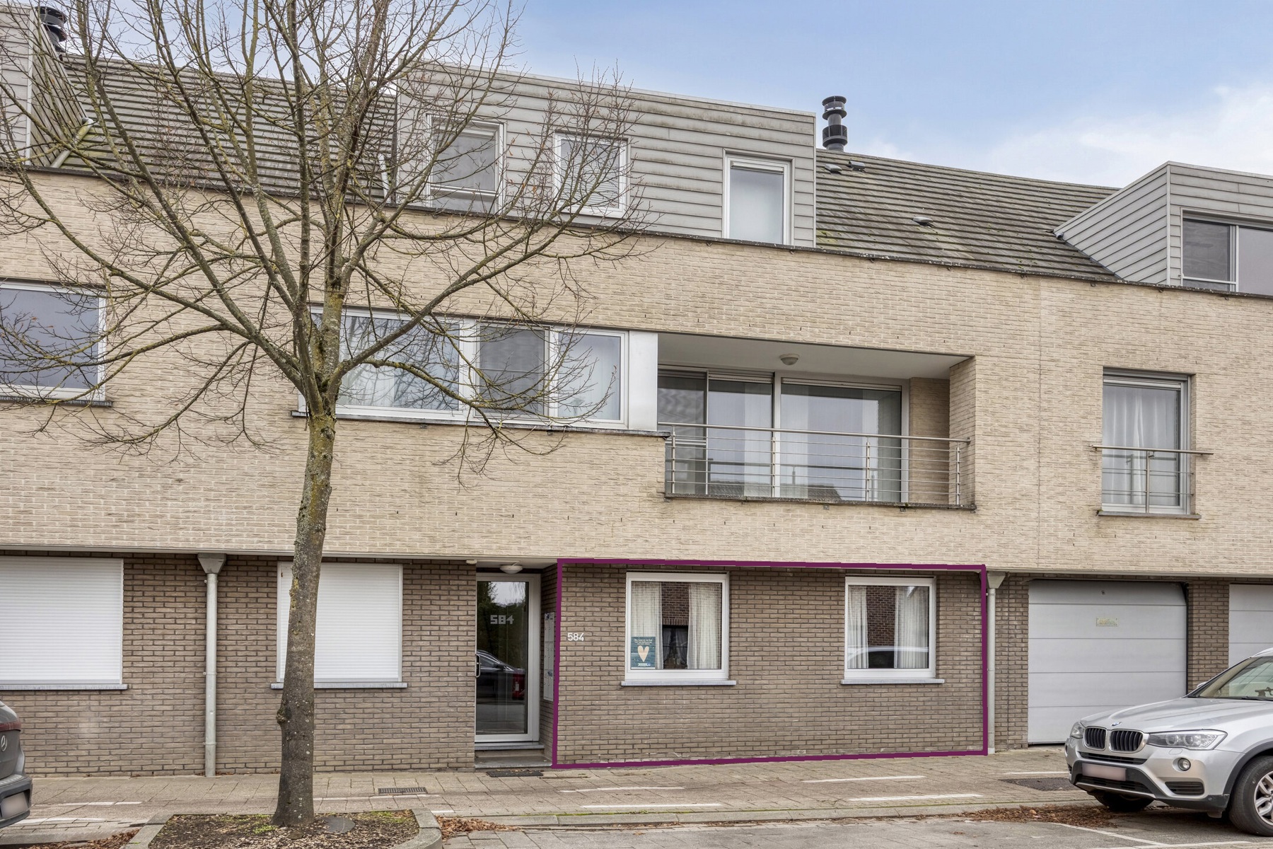 Gelijkvloers appartement met tuin en staanplaats - foto 1