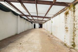 <p>Development lot in the center of Zottegem!</p><p>Located along Heldenlaan, this property features a lot area of 390 m² and offers plenty of possibilities. The existing building, which previously served as a flower shop, includes retail space on the ground floor as well as a first floor and an attic. At the rear is a spacious storage and workshop area that extends all the way to the back of the lot. An added bonus is the access to the street behind it, Vestenstraat, making the lot accessible from two sides.</p><p>According to current urban planning regulations, a project with up to four stories may be built here, provided that the ground floor is used for a purpose other than residential.</p><p>Interested? Contact us for additional information and/or to schedule an on-site visit.<br /> </p>