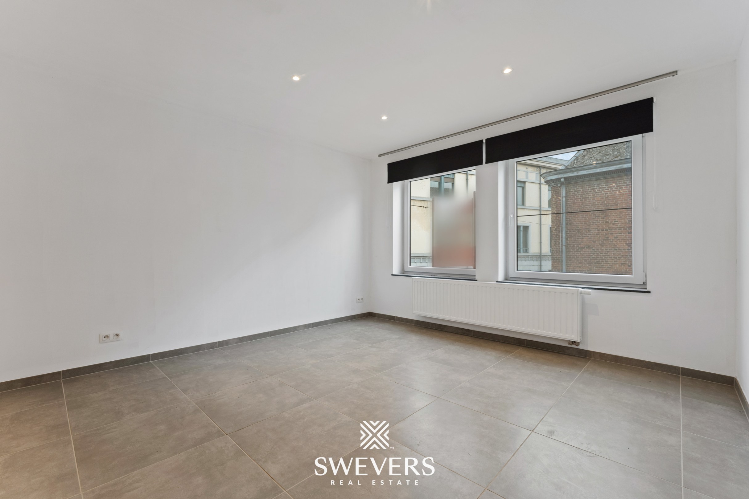 Instapklaar 2-slaapkamer appartement met autostaanplaats in hartje Tongeren - foto 5