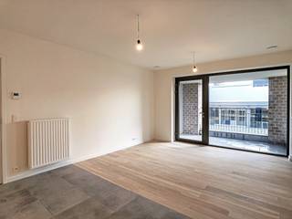 1-slaapkamerappartement te huur in de Parkdreef 25, op de site van Tour & Taxis.Het appartement beschikt over een inkomhal, een ruime woonkamer...
