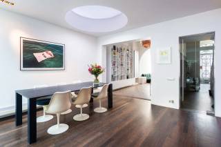 Located on Vrijheidstraat, one of the charming streets in Antwerp's vibrant 't Zuid district, this spacious townhouse offers a perfect blend of classic elegance and modern comfort. Within walking distance, you'll find Marnix Square, the Royal Museum of Fine Arts (KMSKA), and the beautiful Schelde riverbanks, all surrounded by a diverse selection of restaurants, coffee bars, and shops. At the same time, the property benefits from excellent accessibility, with key roads and the city center just moments away.<br /><br />Behind its stylish façade lies an exceptionally spacious home of approximately 285 m², where original architectural details have been beautifully preserved. High ceilings, elegant moldings, parquet floors, and graceful arched doorways create a timeless atmosphere and add a sense of grandeur throughout the various rooms.<br /><br />The ground floor features generous living spaces that flow seamlessly into one another, forming a warm and inviting environment. These areas connect effortlessly to a fully equipped kitchen, fitted with high-quality built-in appliances and ample cabinet space. From the kitchen, you also have direct access to a pleasant terrace.<br /><br />The upper floors offer plenty of space and flexibility, with five full-sized bedrooms plus a sixth room currently used as an office, which can easily be adapted into a dressing room or hobby space. Two spacious bathrooms, each with extensive built-in storage, complete the sleeping quarters.<br /><br />As an added bonus, the property boasts a large rooftop terrace where you can relax and enjoy the sun in peace. Additionally, there is a very spacious cellar storage area, perfect for extra storage needs.<br /><br />This is an exceptionally spacious city townhouse where authentic architecture and contemporary living come together in a sought-after location in Antwerp.<br /><br />Interested? <br />Contact LISTED to arrange a viewing: +32 3 283 51 51.