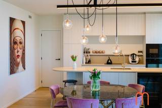 <strong>An iconic seaside address</strong><br />Located in the prestigious <strong>Ensor Tower II</strong>, in the vibrant waterfront district of <strong>Oosteroever</strong> in <strong>Oostende</strong>, this <strong>exceptional luxury apartment</strong> on the 12th floor offers breathtaking panoramic views over the North Sea, the dunes and the coastline.<br />With a living area of <strong>130 m²</strong> and <strong>two generous terraces</strong>, this remarkable residence perfectly combines <strong>modern architecture, high-end comfort and an exclusive seaside lifestyle</strong>.<br /><br /><strong>Bright living space with spectacular sea views</strong><br />Upon entering, you are welcomed by an elegant <strong>entrance hall with guest toilet</strong>.<br />The <strong>spacious, light-filled living room</strong> features large floor-to-ceiling windows offering <strong>stunning panoramic views of the sea and surrounding dunes</strong>.<br />The living area opens directly onto a <strong>beautiful 17 m² terrace</strong>, the perfect setting to relax while enjoying the endless coastal scenery.<br /><br /><strong>Contemporary open kitchen with premium finishes</strong><br />The <strong>beautifully designed open kitchen</strong> seamlessly integrates into the living space and features high-end appliances and refined materials.<br />Combining <strong>sleek contemporary design with practical functionality</strong>, it is ideal for both everyday living and entertaining guests.<br /><br /><strong>Master suite with breathtaking sea views</strong><br />The <strong>master bedroom</strong> is a private sanctuary with <strong>magnificent views of the sea</strong>.<br />It is complemented by a <strong>luxurious bathroom with walk-in shower</strong>, where you can even enjoy the sea view while showering.<br /><br />The suite also includes:<br />a <strong>spacious dressing room</strong><br />a <strong>private toilet</strong><br /><br />A perfect blend of <strong>privacy, comfort and elegance</strong>.<br /><br /><strong>Two additional bedrooms and second terrace</strong><br />The apartment further offers <strong>two additional bedrooms</strong>, ideal for family, guests or a stylish home office.<br />These rooms provide access to a <strong>second terrace of 10 m²</strong> and share a <strong>modern bathroom with shower</strong>.<br />A <strong>spacious storage room</strong> adds further practicality.<br /><br /><strong>Energy-efficient and future-proof living</strong><br /><br /><span>Built in <strong>2023</strong>, the apartment meets the highest standards of energy efficiency and modern comfort:</span><br /><span><strong>Underfloor heating connected to the district heating network</strong></span><br /><span><strong>Energy label A – 49 kWh/m²</strong></span><br /><span>High-quality insulation and advanced technologies</span><br /><br />Ensuring <strong>excellent comfort and low energy consumption</strong>.<br /><br /><span><strong>Key features</strong></span><br /><span>Living area: <strong>130 m²</strong></span><br /><span>Terraces: <strong>17 m² + 10 m²</strong></span><br /><span><strong>Optional underground parking space nr 17 available</strong></span><br /><span>Possibility to acquire the interior furnishings</span><br /><span>Cadastral income: € 1.221</span><br /><br /><strong>A rare opportunity on the Belgian coast</strong><br />This outstanding property combines <strong>luxury finishes, contemporary architecture and breathtaking sea views</strong>.<br /><br />A truly <strong>exclusive opportunity for those seeking a prestigious apartment in Ostend</strong>.