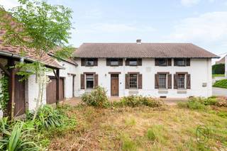 Discover this charming authentic farmhouse, full of character and charm thanks to its warm and traditional materials. Ideally located in the lovely village of Ghoy, close to all amenities of Lessines (shops, schools, train station, highways), it offers a peaceful yet convenient living environment.<br /><br />On the ground floor, you will find an office that can easily be converted into a bedroom, ideal for single-level living, a bathroom, a separate toilet, a spacious living area, a kitchen to be fitted according to your preferences, as well as a cellar. Upstairs, there are three comfortable bedrooms, perfect for family living.<br /><br />The property also features a large adjoining outbuilding (barn/hangar) to renovate, offering numerous possibilities: additional living space, professional use, workshop, or storage.<br /><br />Outside, you will enjoy a large and pleasant garden of over 37 ares, perfect for sunny days, along with a terrace and parking space for several vehicles.<br /><br />Technical features: oil-fired central heating, wooden single-glazed windows, electric boiler, wood stove, EPC F.<br /><br />Some renovation work will allow you to fully unlock the potential and charm of this unique property.<br /><br />More information: aurelie@immobeguin.be