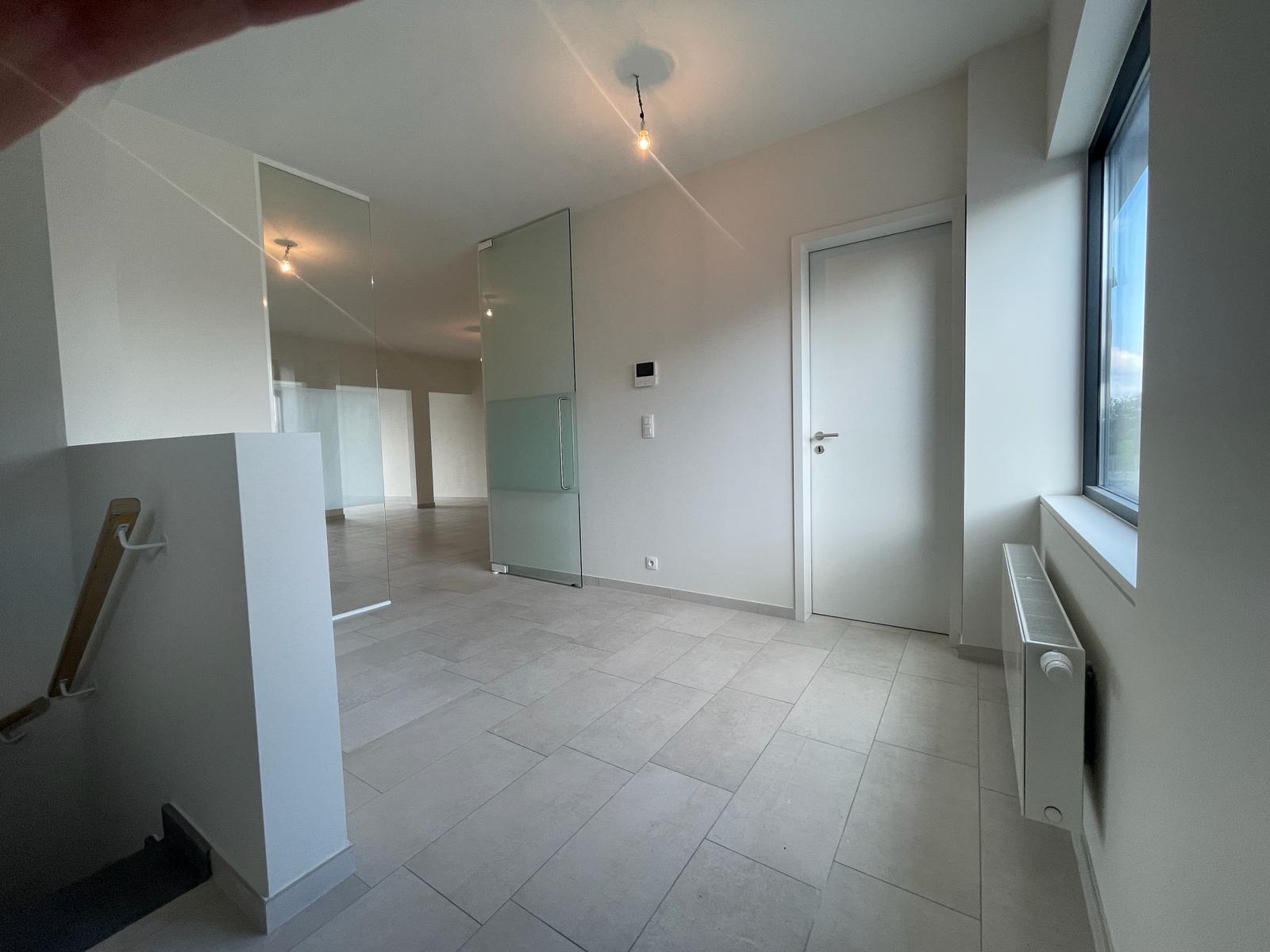 Duplex app met 3 slpks en tuin - foto 2