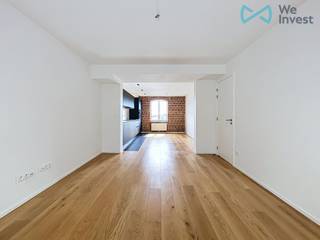 <p><span>Email: </span><span>clara.ja@weinvest.be</span><span> / Tel.: +32 456 12 69 85</span></p>
<p><span>We Invest is pleased to offer this charming and very bright two-bedroom apartment, located on the 3rd floor of a building at 155 Quai des Usines, 1000 Brussels.</span></p>
<p><span>This apartment is part of the Utopia by Godin project, a complete renovation of the iconic Laeken Familistère, located right next to Docks Bruxsel. The apartment features high-quality finishes and plenty of character. It is composed as follows: entrance hall with guest toilet, spacious living room with a fully equipped open kitchen, one bedroom of 16 m², one bedroom of 9 m², and a bathroom. The apartment also includes a cellar and a double-flow ventilation system.</span></p>
<p><span>Very easy access to all parts of the city: the Ring is only 10 minutes away by car, and Rogier can be reached in 12 minutes by tram.</span></p>
<p>Rent: €1250/month<br />Optional parking spot: 100€<br />Charges: €150/month (common charges, heating, and hot water)<br />EPC: C</p>
<p><span>For more exclusive properties, visit </span><span>www.weinvest.be</span><span>.</span></p>