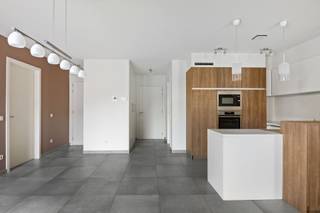 <p><span>Looking for a move-in-ready apartment in a recently built, small-scale residence? Then this spacious one-bedroom apartment, built in </span><span>2016</span><span>, is </span><span> definitely worth a visit. Thanks to its </span><span>energy-efficient EPC rating of A</span><span>, </span><span>underfloor heating</span>,<span> and </span><span>low common</span><span> area </span><span>fees</span>,<span> you’ll enjoy optimal living comfort and low monthly costs here.</span></p><p><span>Through the entryway with built-in closets, you’ll reach the bright living area. The dining room and living room are subtly separated yet remain open to each other, creating a cozy and practical layout. Adjacent to this is the spacious, </span><span>south-facing terrace</span><span>, where you can enjoy the sun all day long.</span></p><p><span>The apartment also features a spacious bedroom with enough room to create a walk-in closet if desired, an adjoining bathroom, a separate guest restroom, and a practical storage/laundry room.</span></p><p><span>The basement level features a </span><span>private parking space</span><span>, a </span><span>private storage room</span><span>, and a </span><span>communal bicycle storage area</span><span>, rounding out the amenities.</span></p><p><span>Thanks to its recent construction, favorable energy rating, and high-quality finishes, this apartment is not only ideal for owner-occupancy but also an excellent investment.</span></p>