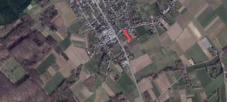 Bouwgrond voor driegevelwoning van 16a53ca vlakbij Mazenzele.Gelegen in woongebied met een landelijk karakter met een zuidoost georiënteerde...