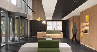 <p>Gelegen in het hart van Louvain-la-Neuve, aan de Boulevard Boudewijn I 25, biedt dit recent gerenoveerde kantoorgebouw een comfortabele, efficiënte en aangename werkruimte die perfect is afgestemd op de noden van moderne bedrijven.</p>
<p>Bij aankomst verwelkomt u een <strong>heldere en warme lobby</strong> die zowel medewerkers als bezoekers een uitstekende eerste indruk geeft. Een <strong>onthaalmedewerker</strong> is aanwezig om een professionele en persoonlijke ontvangst te garanderen.</p>
<p>De <strong>vergaderruimtes</strong> zijn comfortabel, goed uitgerust en stimuleren efficiënt overleg en samenwerking.</p>
<p>In de <strong>gezellige cafetaria</strong> kunt u terecht voor een ontspannen pauze. Deze beschikt over een dagelijks aangevulde <strong>connected fridge</strong>, een waterdispenser en andere praktische voorzieningen.</p>
<p>Voor het comfort van uw medewerkers biedt het gebouw bovendien:</p>
<ul>
<li>
<p><strong>douches</strong> en <strong>lockers</strong>,</p>
</li>
<li>
<p>een <strong>fietsenstalling</strong>,</p>
</li>
<li>
<p>en <strong>autoparking</strong>.</p>
</li>
</ul>
<p>Een moderne, heldere en goed doordachte werkomgeving, perfect gelegen in een bruisende en toegankelijke buurt.</p>