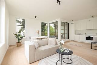 <p><span> </span></p><p><span>Terrazzo tiles, a wooden parquet floor, Whirlpool kitchen appliances, solar panels on the roof: this stylish new construction apartment stands out with its high-quality finish and energy-efficient techniques. You also live here very quietly, with the Rivierenhof around the corner. Other advantages? You only pay 6% VAT if the conditions are met; </span></p><p><span> </span></p><p><span>The immaculate, high-quality finish of this brand-new apartment is immediately striking. The apartment is already fully finished which makes it immediately available. </span></p><p><span> </span></p><p><span>The open kitchen is equipped with appliances from Whirlpool (again a guarantee of top quality), an induction hob and a beautiful worktop. The kitchen is one with the impressively bright living space. Large windows allow plenty of light to enter throughout the day. This space is the beating heart of the apartment: ideal for unwinding or receiving guests.</span></p><p><span> </span></p><p><span>The large sliding window in the open living space opens onto the east-facing terrace. Here there is room for a table with chairs and a lounge chair. You can even install a sofa at the balustrade.</span></p><p><span> </span></p><p><span>The spacious bedroom has the same parquet floor as the living space, Alu windows and built-in ventilation. The ensuite bathroom is luxuriously finished with a walk-in shower with rain tap and ceramic tiles, double sink, a round mirror and terrazzo tiles in stone look. </span></p><p><span> </span></p><p><span>Modern and energy efficient</span></p><p><span> </span></p><p><span>This newly built apartment meets all contemporary standards. Your electricity is generated by 5 solar panels, which you will feel on your energy bill. The inverter and the connection for the washing machine, among other things, are neatly separated in the storage room.</span></p><p><span> </span></p><p><span>Rivierenhof around the corner</span></p><p><span> </span></p><p><span>You live here ideally, close to everything and yet wonderfully quiet and green. The beautiful Rivierenhof, the largest park in the city, is just a few minutes walk away. Within a radius of less than 500 meters are no less than four supermarkets. Many local stores are also nearby. By bike, bus or streetcar you can quickly reach the city, and by car you can get to the highway in no time. </span></p><p><span>The redevelopment of the Wouter Haecklaan has a positive influence in the further development of the neighborhood. </span></p><p><span> </span></p><p><span>Underground car parking space to be purchased for €28,200. </span></p><p><span> </span></p>