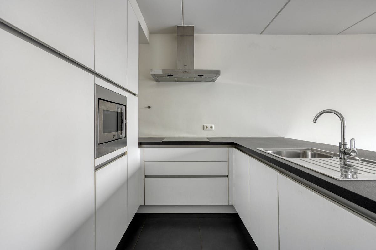 Instapklaar gelijkvloers appartement met aangename tuin - foto 5