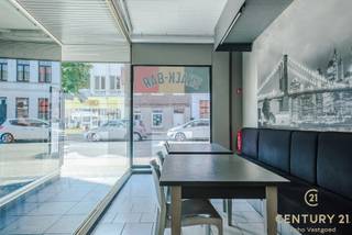 <p><strong>Spacious Commercial Property with Residence in a Prime Location in the Heart of Turnhout</strong></p>
<p>Are you looking for a versatile property with countless possibilities? This surprisingly spacious building, currently set up as a commercial space with an integrated residence, offers a unique opportunity to combine living and working in one location.</p>
<p>The ground floor boasts an exceptionally large commercial area, ideal for a wide range of business activities. Thanks to its flexible layout, internal walls can easily be modified or repositioned to suit your specific needs—perfect for use as a retail space, office, practice, or studio.</p>
<p>Upstairs, the residential area is generously laid out and features multiple bedrooms, a cozy living room, and a fully equipped kitchen. Additional highlights include a spacious, partially covered terrace on the first floor and a lovely city courtyard at the rear—rare features for a centrally located property.</p>
<p>Situated on the vibrant Merodelei, a busy and highly visible arterial road, this property benefits from excellent exposure. It’s just a stone's throw from Turnhout’s central train station, offering great accessibility via public transport and major roadways. Shops, schools, and essential amenities are all within walking distance.</p>
<p><strong>An extra advantage</strong>: the current interior setup can be taken over under <strong>favorable terms</strong>, if desired. What’s more, in consultation, it is possible to <strong>start using the property immediately after signing the preliminary agreement</strong>, so your project can get underway without delay.</p>
<p>In short, this is a property full of potential—offering space, flexibility, and a strategic location—ideal for anyone looking to combine business and living in the heart of Turnhout.</p>