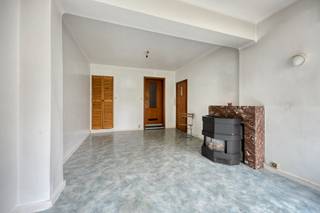 <p>This interesting investment property is located in the sought-after area of Laeken and offers strong potential for investors.</p><p></p><p>On the ground floor, the building features a spacious entrance hall, a garage, and a studio consisting of a living area, kitchen, and bathroom. The ground floor also benefits from access to a pleasant garden.</p><p>The property then consists of three identical apartments spread over the first, second, and third floors. Each apartment includes an entrance hall, a bright living room, a kitchen with access to a balcony, a bathroom, a separate toilet, a storage room, a large bedroom, and an additional room that can serve as a child’s room, office, or dressing.</p><p>The apartments on the first and third floors are currently rented, generating immediate rental income.</p><p>The basement includes several private cellars, providing additional storage space for the entire building.</p><p></p><p>The property requires partial renovation and modernisation, offering an excellent opportunity to unlock its full potential.</p><p>Thanks to its layout, studio, garage, garden, and rented units, this building represents a solid investment in Laeken.</p>