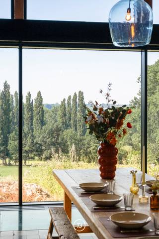 Located on a sun-drenched southern slope in Etikhove, in the heart of the Flemish Ardennes, this exceptional estate is situated on a plot of approximately 5.7 hectares. The property stands out for its combination of refined architecture, spacious volumes, and a unique location with panoramic views of the surrounding nature. Two separate entrances provide easy access and an increased sense of privacy.<br /><br />The main building of 442 m² has been carefully renovated and forms the central living space of this property. Sustainable materials, a thoughtful layout, and high-quality finishes result in a stylish and comfortable whole, suitable as a primary residence or second home.<br /><br />Adjacent to the residence is a spacious night building of 705 m² that can be perfectly arranged as a guest house, additional living space, or versatile use. A separate party barn of 210 m² provides the ideal setting for events or private receptions in a characterful setting.<br /><br />Furthermore, the domain includes a square barn of 250 m² and a separate barn of 420 m², both ideally suited for storage, workshops, craftsmanship, or expansion. For those who value relaxation and luxury outdoor living, there is a fully equipped pool house of 238 m², directly connected to the pool and surrounding terrace areas.<br /><br />Finally, there are 670 m² of stables, one of which is currently under renovation. These offer additional potential for those seeking space for animals, storage, or functional expansion. In total, this property has approximately 1,595 m² of high-quality finished buildings, which is exceptional within this segment.<br /><br />This unique estate offers a rare combination of tranquility, views, volume, and versatility, ideal for those seeking a high-quality farm, a private estate, or a multifunctional property in one of the most beautiful locations in the Flemish Ardennes.<br /><br />Exceptional gem of the Flemish Ardennes.