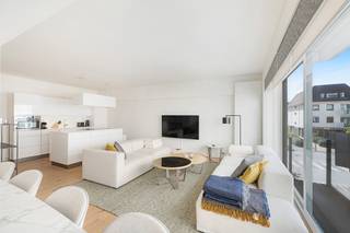 <p>This modern apartment with lateral sea views is ideally located, close to the shops on Kustlaan and just a few steps from the beach and the sea.</p>
<p>Upon entering, you are welcomed into a spacious hall with a wardrobe and a separate guest toilet.</p>
<p>The open kitchen is fully equipped with modern appliances and seamlessly connects to the bright living area. This spacious living room, 6 meters wide, opens onto a cozy balcony and offers space for both a lounge and a dining area.</p>
<p>The apartment features two double bedrooms, each with built-in wardrobes and their own en-suite bathroom or shower room.</p>
<p>Additionally, there are practical amenities, including a bike storage area on the ground floor and a private cellar in the residence.</p>
<p>EPC:</p>