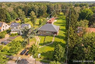<p><span>Welcome to this charming villa brimming with potential, located on an exceptionally spacious plot of no less than 6,270 m². A unique opportunity for those looking for space, tranquility and numerous possibilities to modernize a home completely to your own taste.</span></p><p><span>Layout<br />Through</span><span> the stairs you reach the entrance hall on the second floor, which immediately creates a feeling of space and light. From here you have access to the impressive living space of about 90 m² with open kitchen the ideal place for cozy family moments and receptions. On this floor there are also two spacious bedrooms and a bathroom equipped with bathtub, toilet and double sink.</span></p><p><span>The entrance hall also gives access to an insulated attic, which still offers numerous possibilities as additional living or hobby space.</span></p><p><span>The ground floor surprises with four generous, freely dividable spaces perfect for those who want to create a practice, office or additional living area. There is also an additional bedroom with ensuite shower room and a separate bathroom with bathtub and sink.</span></p><p><span>The garden is accessible both from the back door on the ground floor and from the terrace on the second floor, offering a beautiful open view of the surrounding greenery an oasis of peace and privacy.</span></p><p><span>Additional assets<br />The</span><span> spacious outbuilding of approximately 150 sqm includes a garage with space for several vehicles and a rear space set up as an indoor pool. In addition, the garden features a conservatory and there is a long driveway in front with ample parking.</span></p><p><span>With a living area of approximately 550 m², this property is perfect for various types of living, such as kangaroo living or a combination of living and working.</span></p><p><span>Location<br />Located</span><span> in green Maria-ter-Heide (Brasschaat), near the De Mik domain, you will enjoy a quiet, residential environment with all amenities within easy reach. In the nearby village center you will find schools, stores and numerous facilities. In a few minutes you can reach the on- and off-ramp complex of Sint-Job-in-t-Goor, which ensures excellent accessibility.</span></p><p><span>A property with character, space and endless possibilities ready to be transformed into your dream home.</span></p>