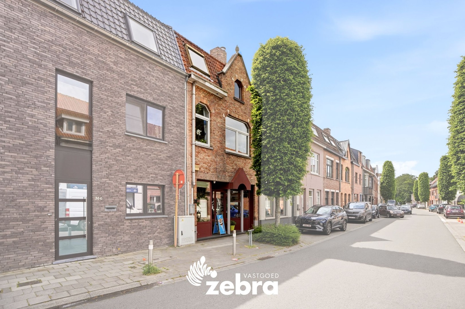 Gesloten bebouwing met 4 slaapkamers, ruime garage en handelsruimte in Sint-Kruis - foto 5