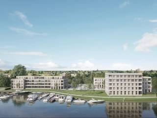 Dit ruime nieuwbouwappartement op de derde verdieping van Havenplein in Schoten biedt een lichte en open leefruimte dankzij de grote raampartijen die mooi uitkijken op het terras. De verbinding tussen binnen en buiten is uitstekend, waardoor je optimaal kunt genieten van natuurlijk licht en het uitzicht.<br /><br />Het appartement beschikt over twee slaapkamers, waarvan de grootste voldoende ruimte biedt voor het inrichten van een dressing. Het ruime terras van 24 m², gericht op het zuiden en zuidwesten, is een absolute blikvanger en laat je volop genieten van de zon en het uitzicht op het water.<br /><br />De open leefruimte en keuken vormen het hart van de woning. Verder is er een badkamer, een apart toilet en praktische bergruimte. Het appartement is duurzaam verwarmd en passief gekoeld via het BEO-veld van Havenplein. Met zijn hoogwaardige afwerking, grote ramen en groene ligging aan het water, is dit een bijzonder comfortabele en eigentijdse thuis.<br /><br />Kenmerken:<br /><br />Derde verdieping<br />Terras: 24 m²<br />2 slaapkamers<br />Ruimte voor een dressing<br />Zuid- en zuidwestgerichte oriëntatie<br />Zicht op het water<br />Grote raampartijen<br />Duurzame verwarming en passieve koeling<br />Verkoopprijs: € 485.000<br /><br />Meer info op havenplein-schoten.be