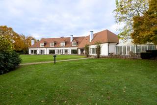 Located in a beautiful villa district within walking distance of the city center of Maaseik, this exceptional villa is very spacious and has a very practical layout, situated on a wide plot of 6709m².<br />The villa offers a very luxurious living comfort with its spacious living areas, wellness area including an indoor pool and jacuzzi, three indoor garages, and a park garden on a fully fenced plot of 67a 09ca.<br />The finish is done in high-quality materials, giving the whole a luxurious and stylish appearance.<br /><br />Layout:<br />Ground floor: entrance hall, cloakroom and guest toilet, office, spacious living room consisting of several parts, kitchen with separate spacious dining room, laundry room, 3 large indoor garages, master bedroom area with dressing room and bathroom, and covered pool area with toilet, shower, and garden room;<br />First floor: spacious landing, separate toilet, large bedroom with en-suite bathroom, 4 bedrooms, two bathrooms, storage space, and party room/hobby room with bar<br />Basement: partly full basement with cool storage space, boiler room, wine cellar, and storage, and partly crawl space and underpinning around (under) the entire pool<br />Attic: over the entire building.<br /><br />Extraordinary features:<br />* 1008m² of living space<br />* 6709m² fully fenced park garden<br />* High-quality and stylish villa<br />* Within walking distance of the city center of Maaseik<br />* Indoor pool, wellness<br />* 6 bedrooms<br />* 4 bathrooms<br />* Party room/hobby room<br />* Indoor garage for 3 cars<br />* Fully basement<br />* Good EPC C