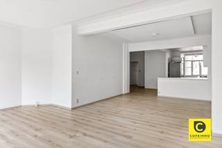 <p><span>Spacious, move-in-ready 1- or 2-bedroom apartment at 't Stadspark!</span><span><br /><br /></span></p><p><span> </span></p><p><span>Filled with passion and expertise, this spacious apartment (105 m²) with a favorable EPC rating has been renovated to a high standard and with great style. It is located on the</span><span><sup>2nd</sup></span><span> floor of a small-scale building with an elevator and enjoys phenomenal natural light. This dream location is just a stone’s throw from Harmonie Park and close to PAKT, an initiative by creative entrepreneurs and urban farmers focused on greener living, self-sufficiency, culture, and gastronomy. Shops, parks, schools, restaurants, and sports facilities are all nearby, as is Antwerp’s vibrant city life, and accessibility is excellent thanks to various access roads and public transportation. In short, the perfect place where modern comfort goes hand in hand with a perfect work-life balance. Don’t miss out on this unique opportunity!</span></p><p><span><br />Entrance hall, living room, kitchen &, laundry room:</span></p><p><span>You enter the apartment through the entry hall, which features a security door and a videophone. The modern steel interior door, as well as the light, solid wood parquet flooring that extends seamlessly throughout nearly the entire apartment, immediately catch the eye and are accentuated by the omnipresent designer lighting. The spacious living area (approx. 31 m²) enjoys a truly magnificent influx of light thanks to the many large aluminum- "-steel-look" windows, ensuring an excellent quality of life. The charming decorative fireplace and the beautiful moldings contribute to the home’s unique character, atmosphere, and coziness. The eye-catching open kitchen, featuring a magnificent ceramic countertop, sits on a travertine-look tile floor, offers ample work and storage space, and is equipped with high-quality appliances. Adjacent to it is the separate laundry room, which provides ample space for your pantry supplies and cleaning supplies.</span></p><p><span> </span></p><p><span>Bedrooms, bathroom & e toilet:</span></p><p><span>Two of the three bedrooms open onto the terrace; all feature hardwood floors and overlook the greenery at the rear. The smaller room is perfect as a walk-in closet, home office, children’s room, or guest room. In the luxurious bathroom, you can completely unwind in the spacious walk-in/rain shower. It also features a double vanity with sinks and waterfall faucets, a towel radiator, and mechanical ventilation. The separate toilet with a hand sink is located elsewhere.</span><span><br /><br />Terraces, basement &, and bike storage:</span><span><br />Through the kitchen, you have access to the cozy indoor terrace at the front with a built-in storage area. The extra-wide south-facing terrace is located at the rear, adjacent to the bedrooms. With a touch of natural beauty to top it off, this is a phenomenal place to completely unwind after a busy workday, whether or not with a good glass of wine in hand. It’s a unique opportunity to dine al fresco, relax in the lounge, or garden at this elevation right in the heart of the city every day. Also worth noting is the private, dry basement storage room (4 m²) that’s included. In addition, the building features a bike storage area where your bike will always be kept dry and safe.</span></p><p><span><br />Additional highlights:</span></p><p><span>- Prime location (Mobiscore 9.5/10)</span></p><p><span>- EPC B</span></p><p><span>- 105 m² according to EPC</span></p><p><span>- First occupancy after renovation</span></p><p><span>- High-quality finishes</span></p><p><span>- New high-efficiency windows (", aluminum steel-look")</span></p><p><span>- New radiators</span></p><p><span>- Electrical system up to code</span></p><p><span>- 2 terraces</span></p><p><span>- 3 bedrooms</span></p><p><span>- Includes designer lighting</span></p><p><span>- Asbestos-safe<br />- Basement and bike storage</span></p><p><span> </span></p>