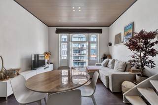 <p>Looking for a spacious apartment by the sea with just that extra touch of character? This move-in ready duplex of 95 m² is centrally located in Blankenberge and combines the charm of a characterful building with the comfort of a contemporary apartment.</p><p></p><p>Thanks to its location, you'll live within walking distance of the seafront promenade and the beach, while shops, restaurants, public transport and the train station are also nearby. This makes the apartment appealing not only as a permanent residence, but also as a comfortable second home or as a property investment on the Belgian coast.</p><p></p><p><strong>Spacious living spread over two floors</strong></p><p>The apartment is located on the third and fourth floors and features a pleasant duplex layout. With a livable surface area of 95 m², there's remarkably plenty of space for a coastal apartment.</p><p></p><p>Inside you'll find a cosy living area and a fitted kitchen. The two full-size bedrooms offer ample space for a couple, family or guests, making this apartment particularly appealing for those who like to regularly welcome family or friends to the coast.</p><p></p><p>The bathroom was completely renovated in 2025, giving the apartment a fresh, contemporary feel. A small terrace at the front provides additional outdoor space.</p><p></p><p>You also have a private cellar and a small bicycle storage area: practical extras that certainly come in handy at the coast.</p><p></p><p><strong>Move-in ready with character</strong></p><p>Over the years, the apartment has been well maintained and renovated, and is now move-in ready. The electrical installation is compliant, heating is individual on natural gas, and the apartment features double glazing. The building's communal areas have also been refreshed.</p><p></p><p>A special asset is the character of the building itself. The property is listed as recognised architectural heritage, setting it apart from the many classic apartment residences found along the coast. The authentic architecture gives the whole a distinctive look and identity.</p><p></p><p><strong>Living, enjoying or investing by the sea</strong></p><p>With its 95 m² of living space and two bedrooms, this apartment is exceptionally versatile. For those wishing to live permanently in Blankenberge, it offers plenty of space and a highly central location. For those dreaming of a second home by the sea, this apartment allows family or friends to stay comfortably as well. And for investors, the combination of two bedrooms, a generous surface area and a location close to both the centre and the coast offers interesting possibilities.</p><p></p><p>The apartment is located on the third floor and the building does not have a lift. This is a point we're happy to mention transparently, though it also contributes to the small-scale character of the building.</p><p></p><p>Curious whether this characterful apartment could become your new place by the sea? Schedule your visit and discover for yourself the space, location and possibilities of this duplex in Blankenberge.</p>