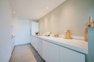 VIEW VIA IMMODAVINCI.BE<br /><br />Location<br /><br />Situated on Henri Dunantlaan in Ghent, in an easily accessible location close to the city centre, public transport and major access roads.<br /><br />Layout<br /><br />This light-filled flat, situated on the fourth floor, welcomes you with a spacious living area opening onto the south-west-facing terrace. The adjoining kitchen is practically laid out and offers all the necessary comforts.<br />The flat has three full-sized bedrooms, ideal for families, working from home or as a hobby room. The master bedroom features an en-suite bathroom and a private second terrace. There is also a second bathroom and built-in cupboard space in the night hall. The service charge amounts to 105 euros.<br /><br />Key features<br /><br />3 full-sized bedrooms<br />2 bathrooms for optimum comfort<br />2 terraces for the best possible outdoor experience<br />2 parking spaces included<br />Practical storage room<br />Central location with excellent transport links