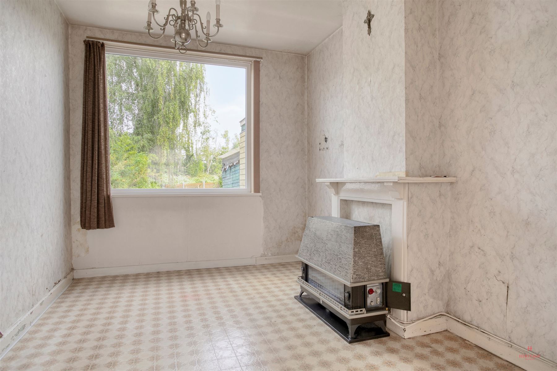 Gunstig gelegen te renoveren rijwoning met tuin - foto 5